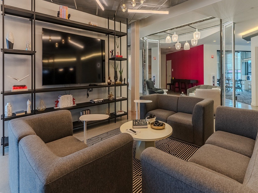 a living room with couches and a television